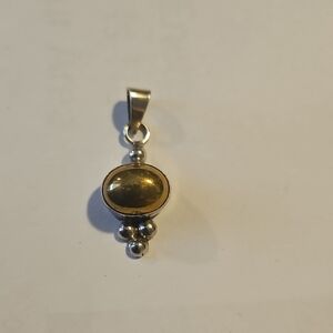 Elegant Gold and Silver Pendant